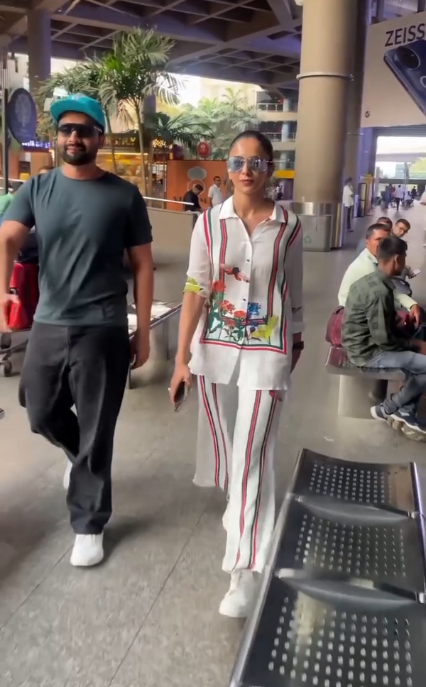 White floral-striped Butterfly Lane co-ord set with a shirt collar and relaxed pants, styled for travel