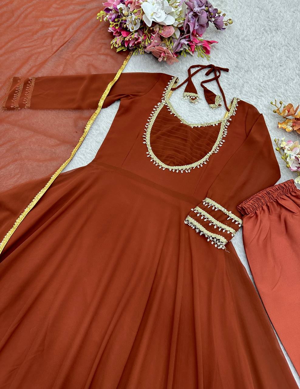party wear brown anarkali set with golden border detailing