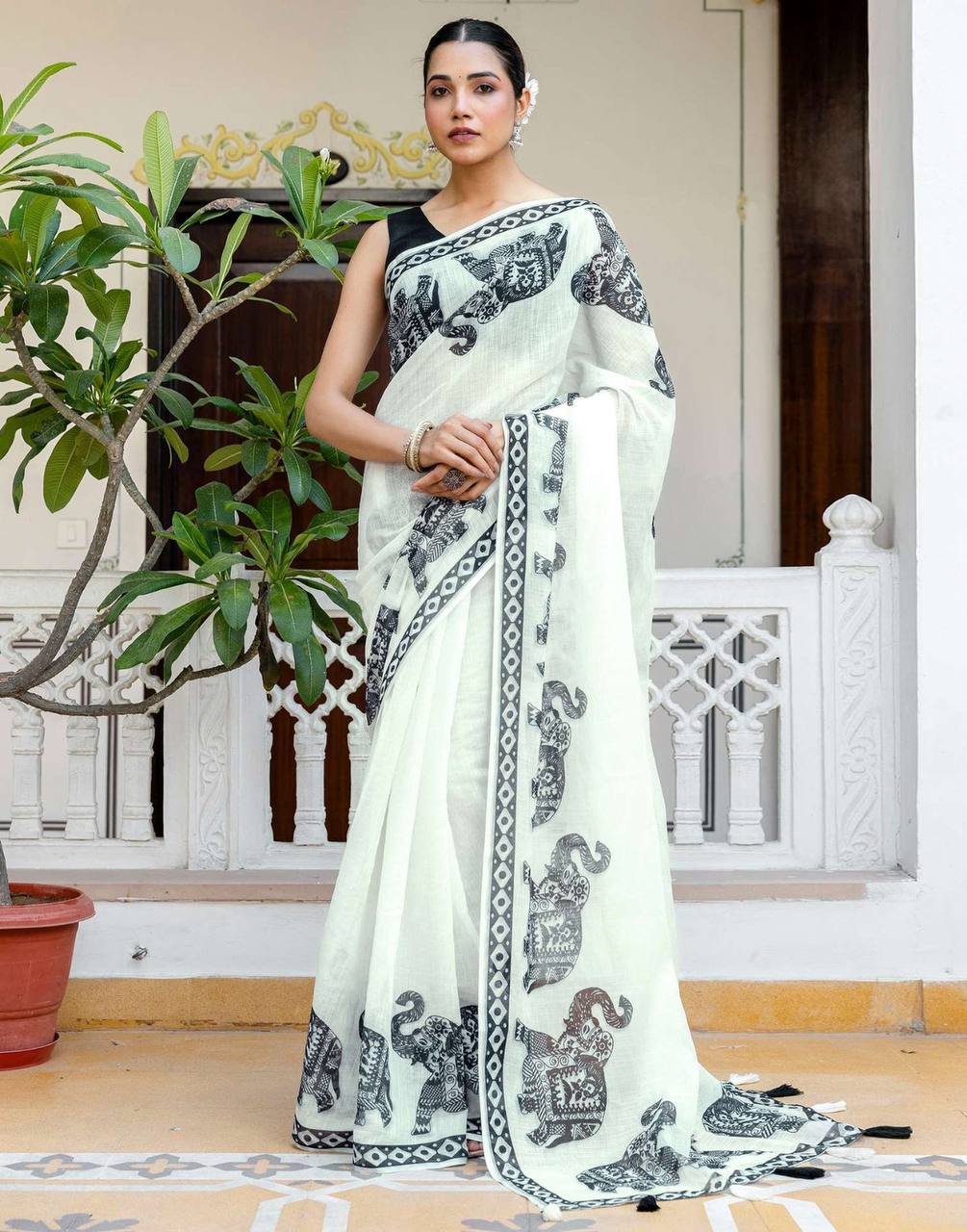 linen digital printed saree with elegant elephant motifs & stylish latkans