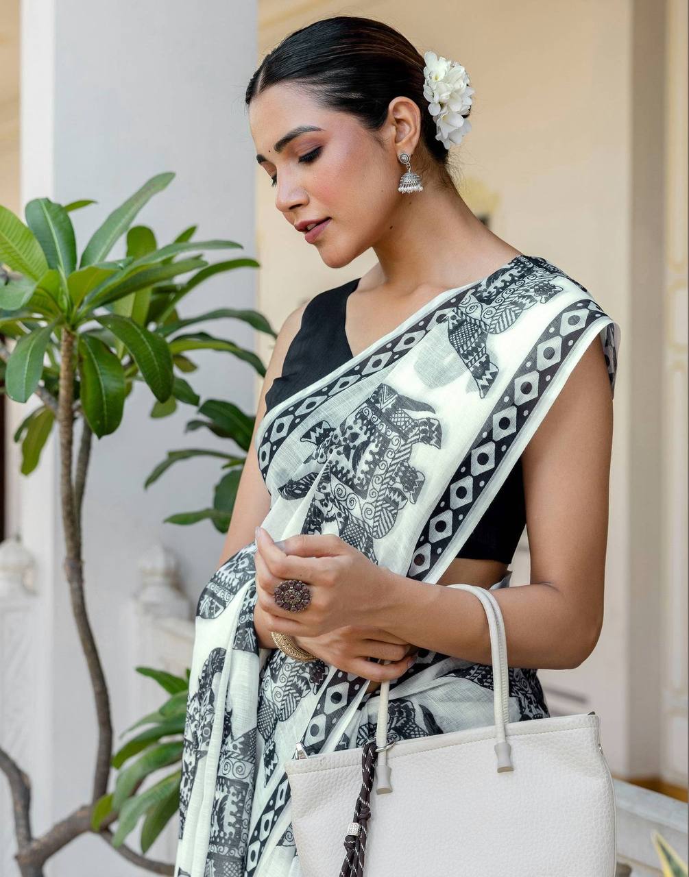 linen digital printed saree with elegant elephant motifs & stylish latkans