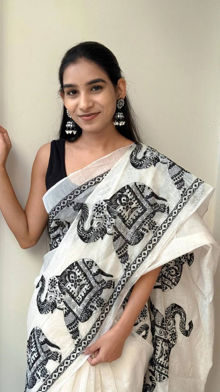 linen digital printed saree with elegant elephant motifs & stylish latkans